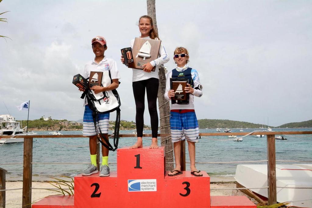 Top Three Overall Winners in the 2016 International Optimist Regatta, presented by EMS Virgin Islands, L to R: the USA’s Daven Subbiah (second), USVI’s Mia Nicolosi (first), and USA’s Stephan Baker (third). © Dean Barnes