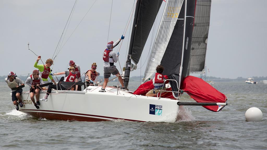 One of more than six teams crewed by College of Charleston Sailing Team members at Sperry Charleston Race Week 2017, the crew of the Melges 30 Cougar springs into action at the top mark on Circle 3. The Cougars finished just out of the running despite winning the final day of racing in their class. © Meredith Block/ Charleston Race Week http://www.charlestonraceweek.com/