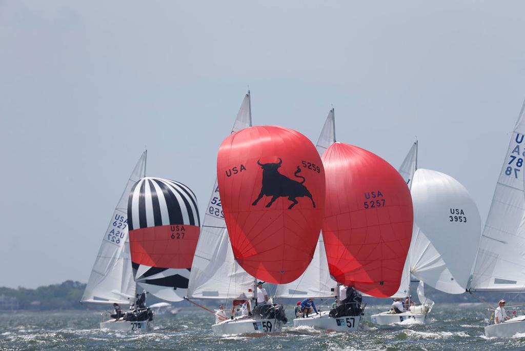 Bright colors and beautiful shapes bely the athleticism and smarts required to get a J/24 around the track in big breeze during Day 2 of Sperry Charleston Race Week 2017. © Tim Wilkes / Charleston Race Week