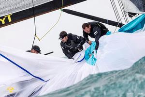 Team Nika retrieve their kite after a poor spinnaker drop - RC44 Sotogrande Cup photo copyright Martinez Studio taken at  and featuring the  class