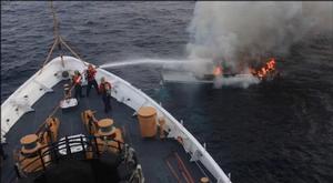 Coast Guard members aboard the USCG STEADFAST battling the fire on the “Tarry-A-Bit” photo copyright U.S. Coast Guard taken at  and featuring the  class
