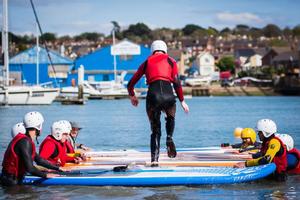 Having fun and building confidence on the water at UKSA during the Aberdeen Asset Management Confidence Masterclass. UKSA use the power of the sea as a catalyst for change in young people's lives. photo copyright Aberdeen Asset Management taken at  and featuring the  class
