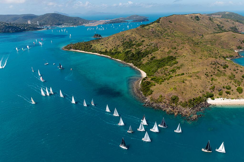 Part of a huge fleet of yachts competing at Audi Hamilton Island Race Week heads away from the island and towards the Whitsunday Passage. ©  Andrea Francolini Photography http://www.afrancolini.com/