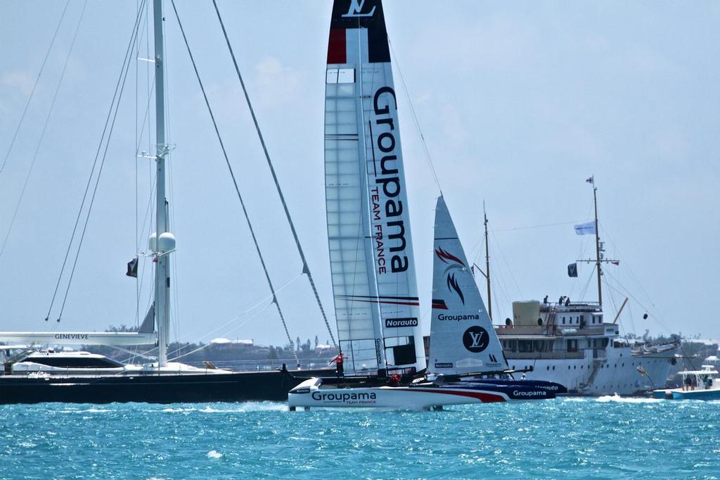 Groupama Team France sails alongside the super yachts , Race 13 - Round Robin 1 - America's Cup 2017, May 29, 2017 Great Sound Bermuda © Richard Gladwell www.photosport.co.nz