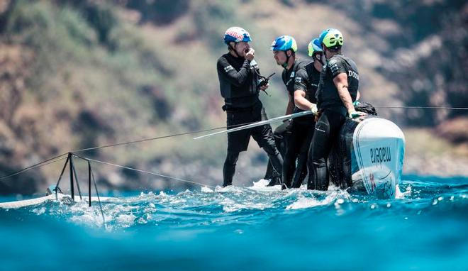 Roman Hagara's Red Bull Sailing Team capsized before racing on day three of Extreme Sailing Series Act 3 in the Madeira Islands. © Lloyd Images http://lloydimagesgallery.photoshelter.com/