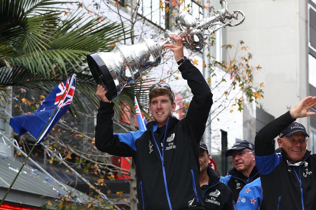 Peter Burling of Emirates Team New Zealand holds the Louis Vuitton Cup aloft during the Team New Zealand Americas Cup Welcome Home Parade on July 6, 2017 in Auckland, New Zealand.  (Photo by Hannah Peters/Getty Images) photo copyright Getty Images taken at  and featuring the  class