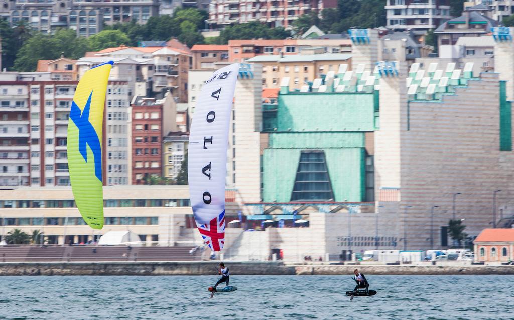 Kiteboarders race in front of the Festival Palace - 2017 World Cup Series Final - Santander photo copyright Pedro Martinez / Sailing Energy / World Sailing taken at  and featuring the  class