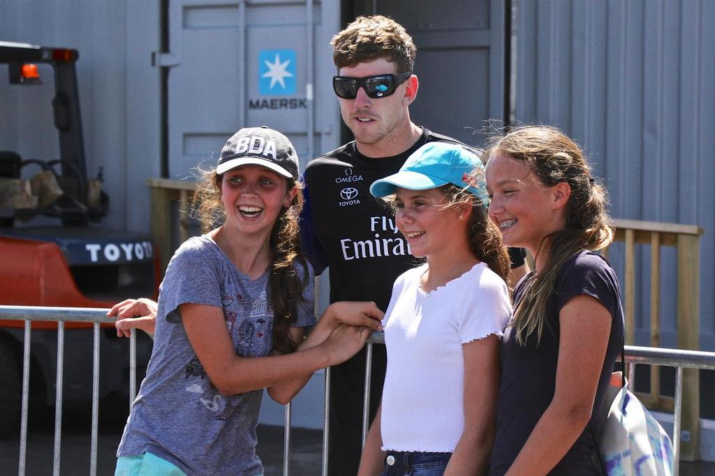 Emirates Team New Zealand's Peter Burling poses with some young supporters in Bermuda at the fence around the team base.-Bermuda  June 21, 2017 © Richard Gladwell www.photosport.co.nz