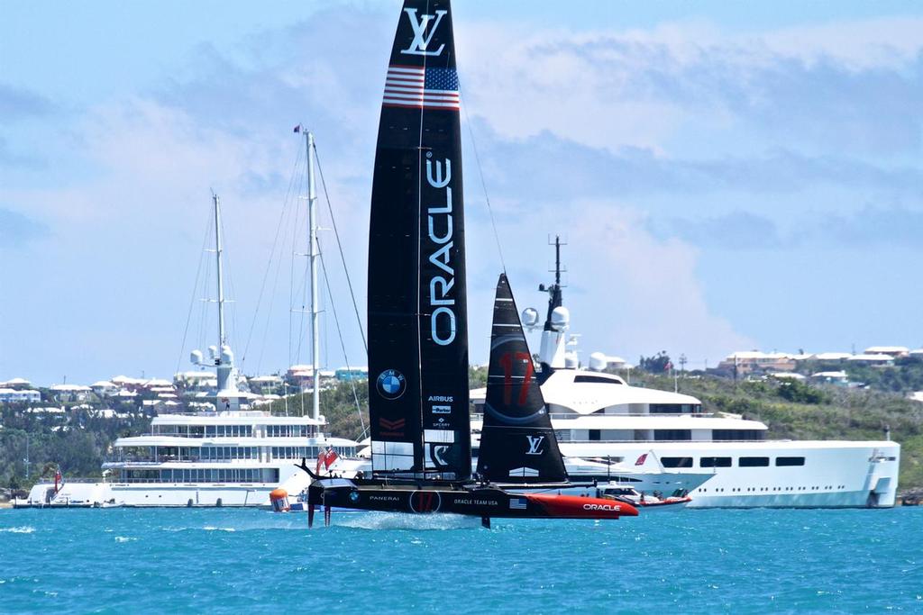 Oracle Team USA sails past the superyachts of Larry Ellison and Ernesto Bertarelli - Match, Day  4 - Race 7 - 35th America's Cup  - Bermuda  June 25, 2017 photo copyright Richard Gladwell www.photosport.co.nz taken at  and featuring the  class