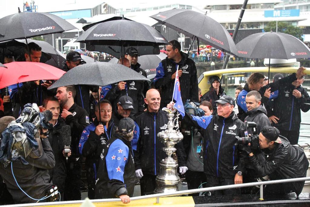 Emirates Team New Zealand - Sir Stephen Tindall places a NZ flag in the America’s Cup as the Auld Mug embarks on a harbour tour - Parade in  Auckland,   July 6, 2017 © Richard Gladwell www.photosport.co.nz