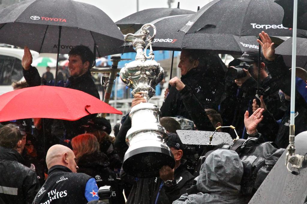 Emirates Team New Zealand - the Auld Mug is presented to the fans as the rain pelts down - Parade in  Auckland,   July 6, 2017 © Richard Gladwell www.photosport.co.nz