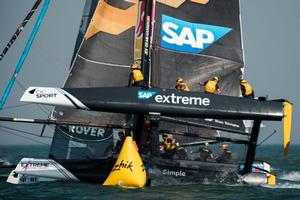Act 2, Extreme Sailing Series Qingdao - Day 1 - SAP Extreme Sailing Team and Red Bull Sailing Team – Spectators can also watch the action for free from nearby Sant Sebastià, Barcelona’s longest beach photo copyright  Xaume Olleros / OC Sport taken at  and featuring the  class