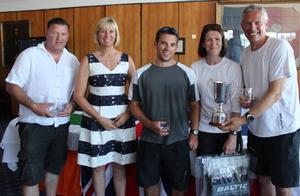 J.A.T. J/80 Open National Champions. (R-L) Skipper Kevin Sproul, Helen Yates, Chris Fisher, RSrnYC Commodore Karen Henderson-Williams (presenting award), and Adrian Gray. photo copyright  Louay Habib / RSrnYC taken at  and featuring the  class