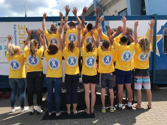 Volunteers reveal the new-look branding now adopted by the Andrew Simpson Foundation to tie in with a host of new charitable activities to be announced. © Andrew Simpson Foundation