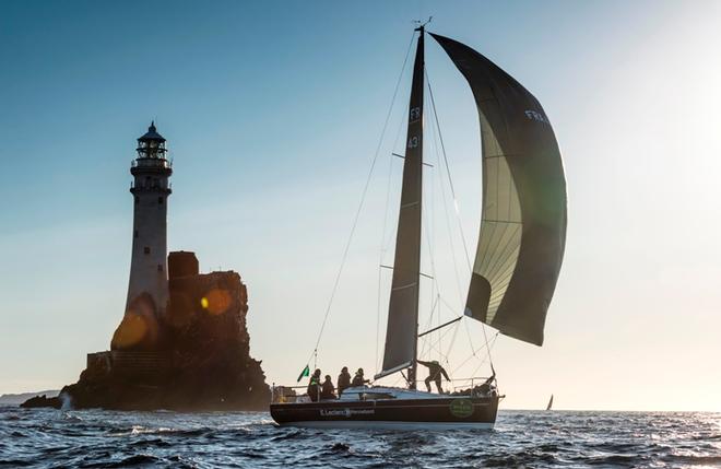 Spinnaker sailing in front of the Fastnet Rock for French yacht Cocody – Rolex Fastnet Race © Quinag