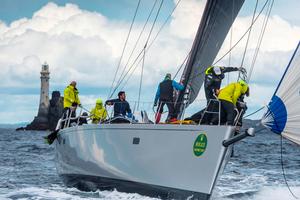 The crew of Aragon have no time to admire the Fastnet Rock as they clear the foredeck after a sail change – Rolex Fastnet Race photo copyright Quinag taken at  and featuring the  class