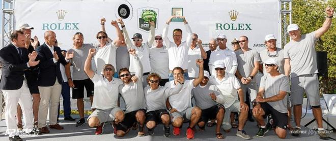Harm-Müller Spreer’s Platoon Team proudly lifting the Rolex TP52 World Championship Trophy in May this year. ©  Nico Martinez / Martinez Studio