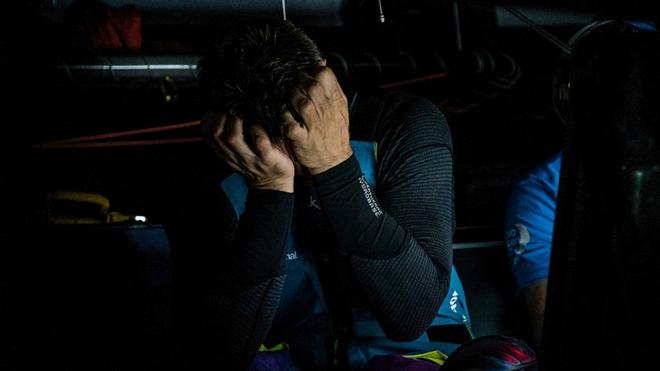Leg 1, Day 5 – Alicante to Lisbon, onboard team AkzoNobel. Dutch Skipper Simeon Tienpont gets the latest position reports from Race Control – Volvo Ocean Race ©  Konrad Frost / Volvo Ocean Race