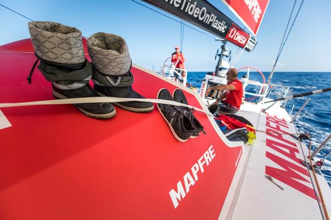 Leg 1, Day 3 – Alicante to Lisbon, onboard MAPFRE. The sailors improvise as they try and dry their boots whilst there are no waves crashing over the deck – Volvo Ocean Race ©  Ugo Fonolla / Volvo Ocean Race