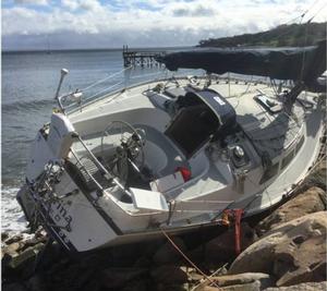 The sailing vessel Carina sits on rocks after being washed ashore near Apponagansett Bay, Massachusetts, after a powerful storm hit the Northeast, Sunday, Oct. 29, 2017. Coast Guard crews from Maine down to Rhode Island have identified over 50 vessels that were torn from their moorings and were found either unmanned and adrift or washed up on land photo copyright U.S. Coast Guard District 1 taken at  and featuring the  class