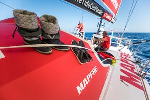 Leg 1, Day 3 – Alicante to Lisbon, onboard MAPFRE. The sailors improvise as they try and dry their boots whilst there are no waves crashing over the deck – Volvo Ocean Race photo copyright  Ugo Fonolla / Volvo Ocean Race taken at  and featuring the  class