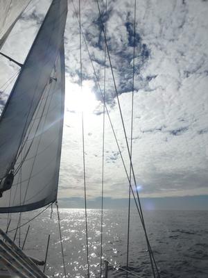 A rare and perfect day - three full sails under blue skies and marshmallow clouds photo copyright  Kristen Anderson taken at  and featuring the  class