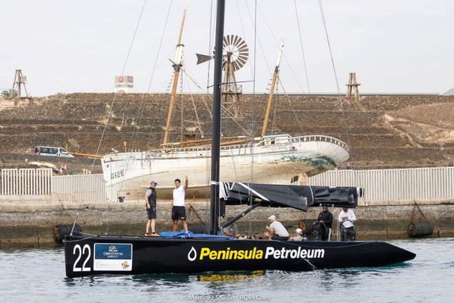 Peninsula Petroleum owner John Bassadone waves from the bow as the teams return to Marina Lanzarote to await further instructions – RC44 Calero Marinas Cup ©  Martinez Studio / RC44 Class
