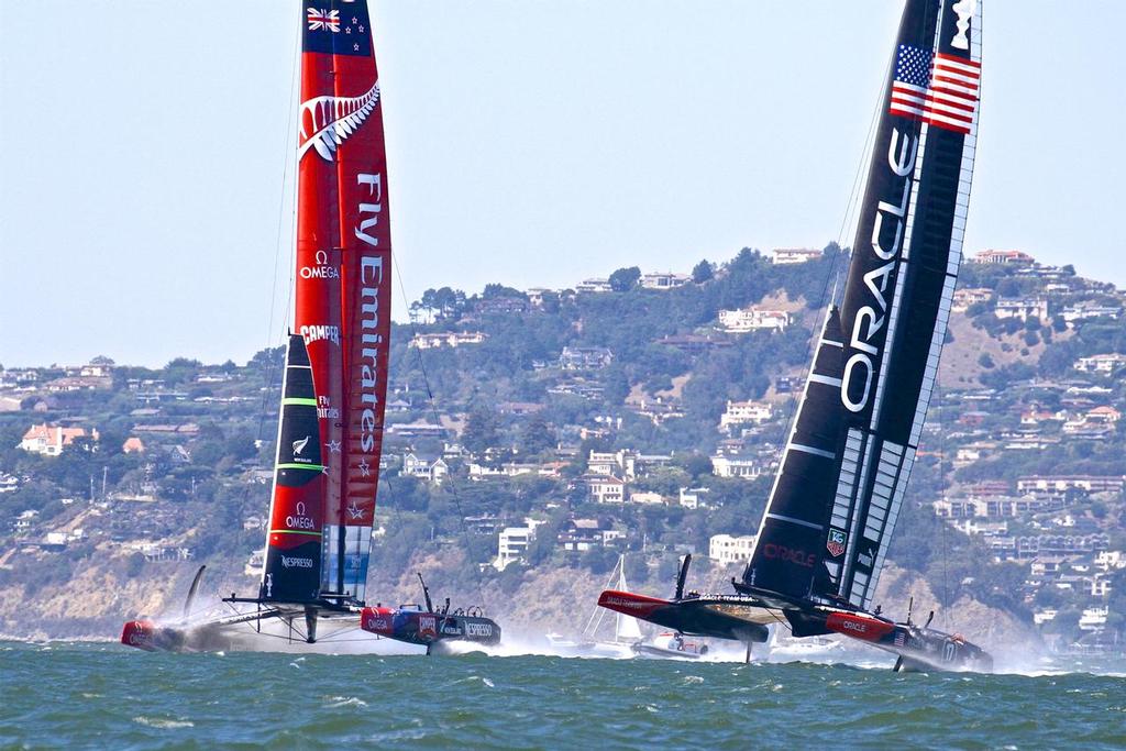 Emirates Team New Zealand with Oracle Team USA mid-way through the 34th America’s Cup in San Francisco. © Richard Gladwell www.photosport.co.nz