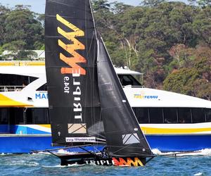 Triple M races the Manly Ferry on the way to victory in Race 7 of the 18ft Skiffs Spring Championship photo copyright  Frank Quealey / Australian 18 Footers League taken at  and featuring the  class