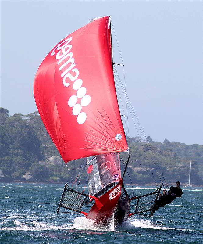Smeg charges downwind after an earlier capsize cost her the lead in race 1 of the 18ft Skiff NSW Championship photo copyright Frank Quealey taken at Australian 18 Footers League and featuring the 18ft Skiff class