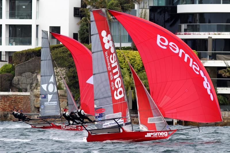 Smeg and Noakesailing had a great battle down the first spinnaker run in the 18ft Skiff R. Watt Memorial Trophy photo copyright Frank Quealey taken at Australian 18 Footers League and featuring the 18ft Skiff class