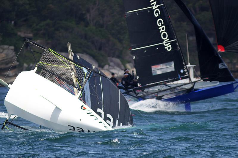 Vintec takes a nose dive as Winning Group passes in the background on the run into Rose Bay during 18ft Skiff NSW Championship race 4 photo copyright Frank Quealey taken at Australian 18 Footers League and featuring the 18ft Skiff class