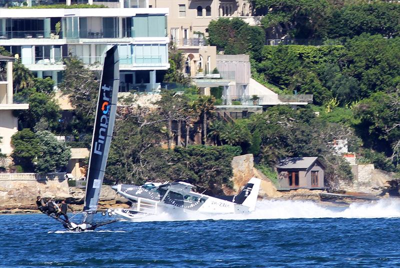 Finport Finance approaches the final windward mark as a sea-plane lands just a short distance ahead of the skiff in race 1 of the 18ft Skiff Club Championship on Sydney Harbour photo copyright Frank Quealey taken at Australian 18 Footers League and featuring the 18ft Skiff class