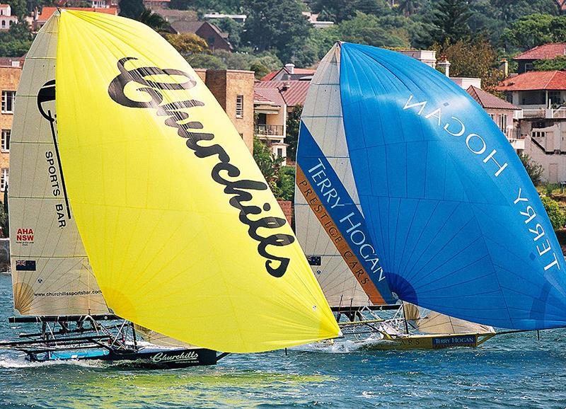Local teams Churchill's Sports Bar and Terry Hogan Prestige Cars battle it out during the 2002 regatta - JJ Giltinan World Championship photo copyright Frank Quealey taken at Australian 18 Footers League and featuring the 18ft Skiff class