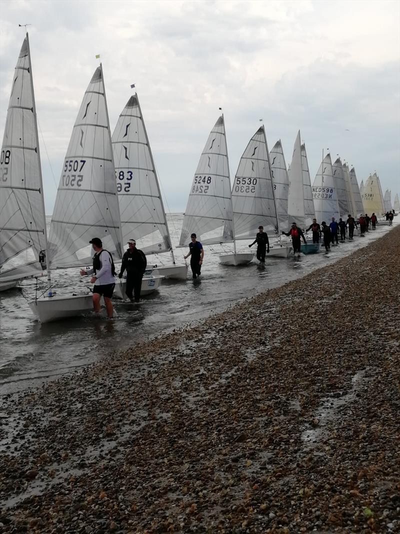 The fleet walking their boats back in no wind after the last race at the Magic Marine National Solo Championship at Hayling Island photo copyright Peter Halliday taken at Hayling Island Sailing Club and featuring the Solo class