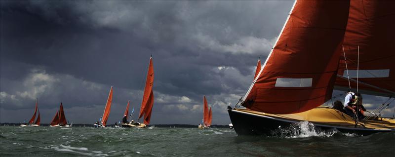 Action from the Squib fleet competing at Skandia Cowes Week photo copyright onEdition taken at  and featuring the Squib class