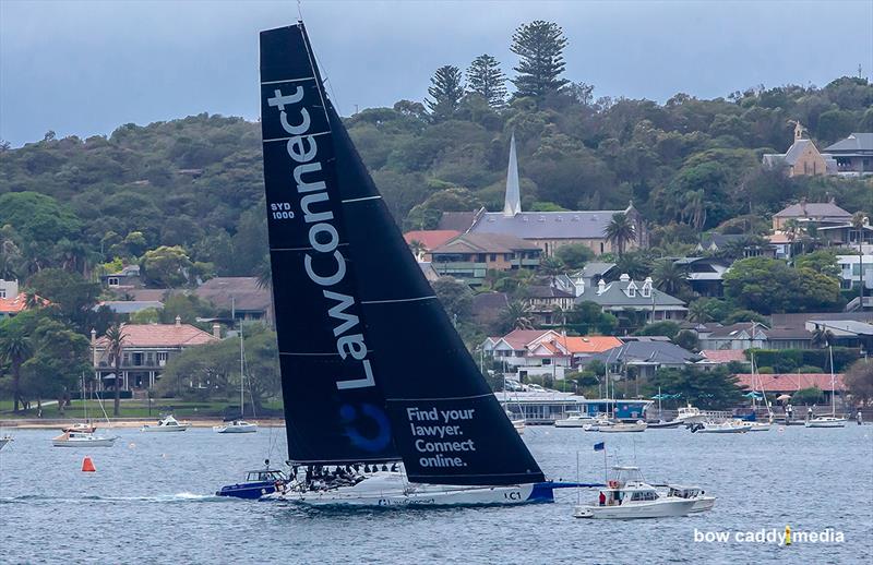 LawConnect crosses the finish line photo copyright Crosbie Lorimer – Bow Caddy Media taken at Cruising Yacht Club of Australia and featuring the Superyacht class