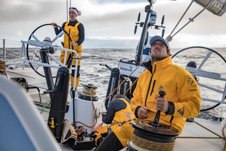 Leg 3, Cape Town to Melbourne, day 16, on board Turn the Tide on Plastic. Only 174 nm to go and the battle with Scallywag for 5th place is on, Frederico De Melo triming, Dee in her Santa outfit focus in the back photo copyright Jeremie Lecaudey / Volvo Ocean Race taken at  and featuring the Volvo One-Design class