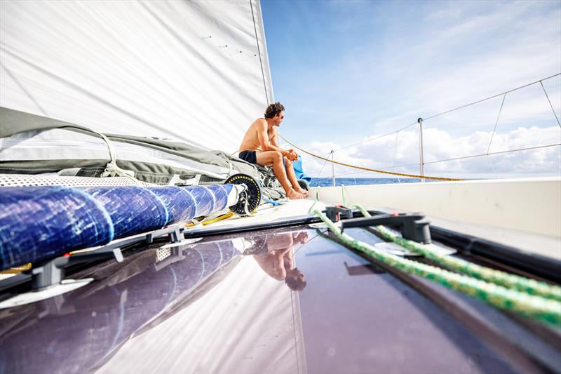 Leg 4, Melbourne to Hong Kong, day 11, Roerto Bermudez `Chuny` waits patiently on the bow for the return of wind to Vestas 11th Hour after a sunrise rainstorm photo copyright Amory Ross / Volvo Ocean Race taken at  and featuring the Volvo One-Design class