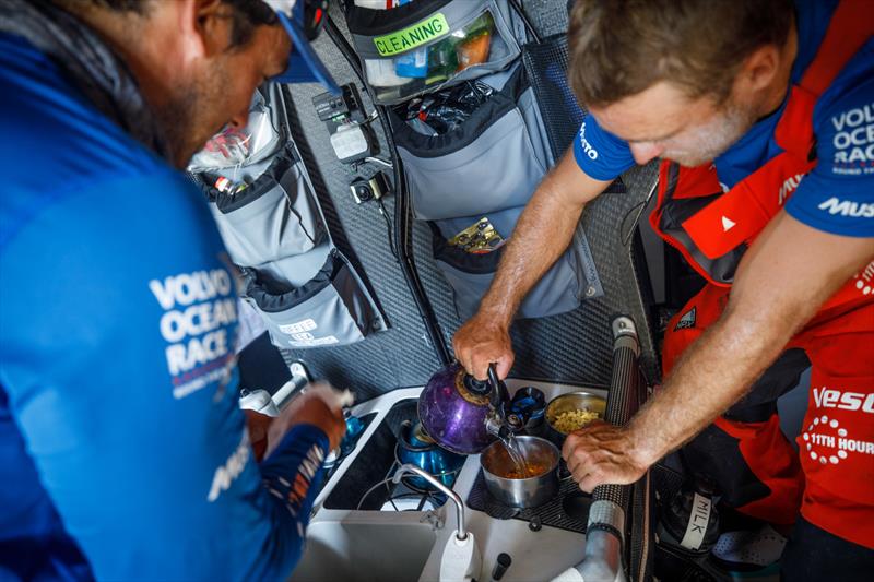 Leg 4, Melbourne to Hong Kong, day 15, watch partners Nick Dana and Mark Towill make lunch in the galley on board Vestas 11th Hour. - photo © Amory Ross / Volvo Ocean Race