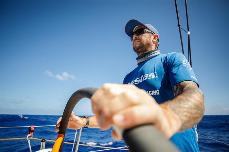 Leg 4, Melbourne to Hong Kong, day 15, Phil Harmer takes a turn at the wheel in a lumpy and bumpy sea state on board Vestas 11th Hour photo copyright Amory Ross / Volvo Ocean Race taken at  and featuring the Volvo One-Design class