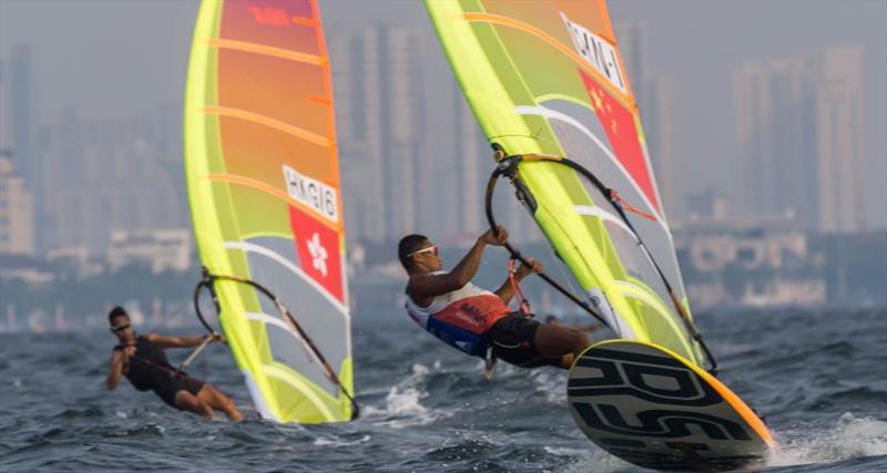 Asian Games 2018. Bi Kun (CHN) leads the RS:X pack on day 1 photo copyright Carmelita taken at  and featuring the Windsurfing class