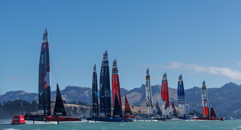 The fleet in action led by Spain SailGP Team as they cross the start line on Race Day 2 of the ITM New Zealand Sail Grand Prix in Christchurch, New Zealand photo copyright Chloe Knott for SailGP taken at  and featuring the F50 class