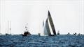 © Paul Darling Australia II about to cross the finish line marked by the Committee Boat, Black Knight, to win the America's Cup - September 26, 1983 © Paul Darling