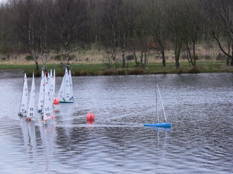 Action at the first weather mark during the Scottish District IOM Travellers at Levenhall photo copyright Ian Dunda taken at Levenhall Radio Yacht Club and featuring the One Metre class