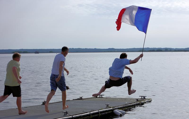 The winners celebrating with a dunk at the 2026 IOM Worlds - Alexis, Zvonko and Rob photo copyright Mark Jardine taken at Datchet Water Sailing Club and featuring the One Metre class