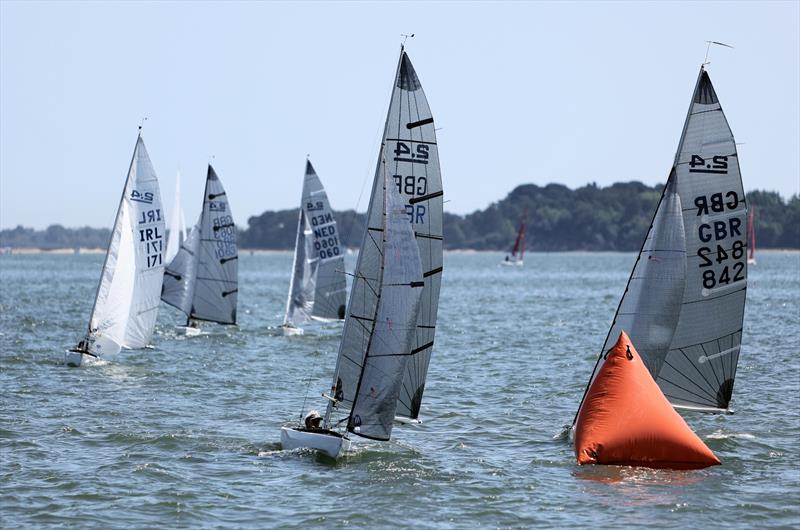 2.4mR fleet downwind on Sunday at the International Paint Poole Regatta 2026 photo copyright Mark Jardine taken at Parkstone Yacht Club and featuring the 2.4m class