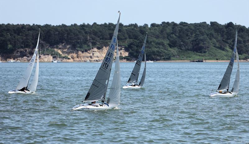 2.4mR fleet upwind on Sunday at the International Paint Poole Regatta 2026 photo copyright Mark Jardine taken at Parkstone Yacht Club and featuring the 2.4m class