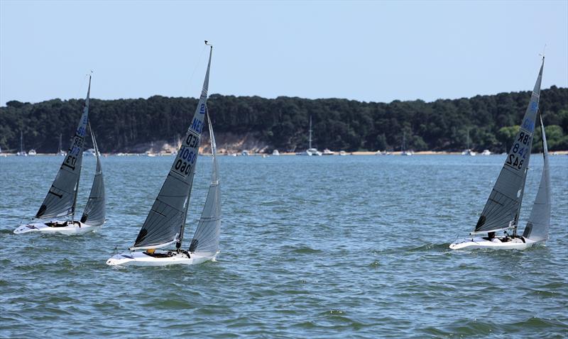 2.4mR fleet upwind on Sunday at the International Paint Poole Regatta 2026 photo copyright Mark Jardine taken at Parkstone Yacht Club and featuring the 2.4m class