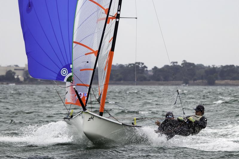 Yeah Baby Skippered by Oscar Henderson and crewed by Patrick Distefano working hard with the kite photo copyright Alex McKinnon Photography taken at Royal Geelong Yacht Club and featuring the 29er class